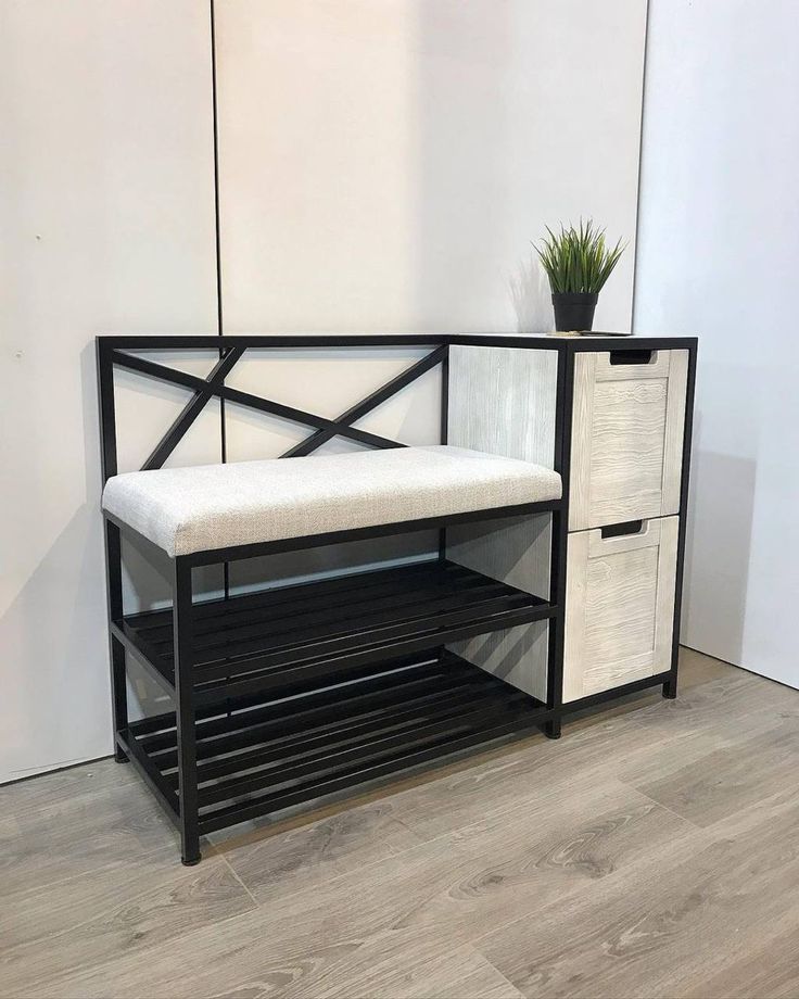 raised metal bed with space for a couch under it with staircase