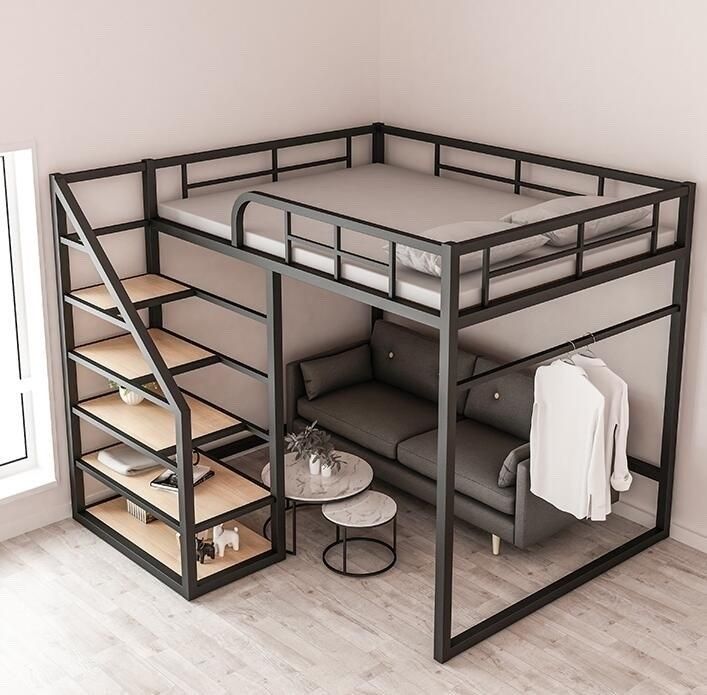 raised metal bed with space for a couch under it with staircase