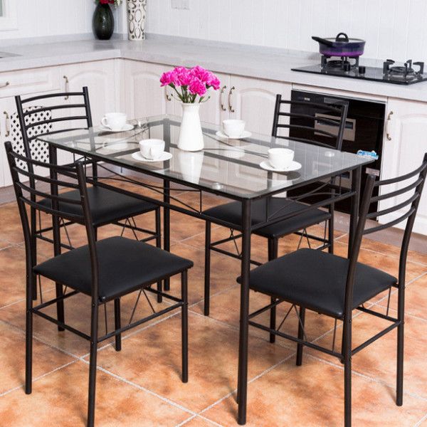 four seater cusioned metal seat with a glass table